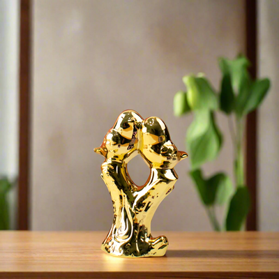 Shimmering Golden Birds on Bark Figurine