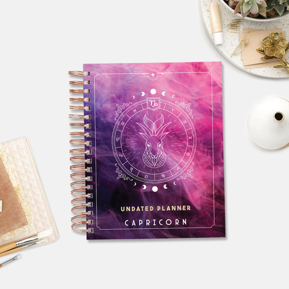 Capricorn Celestial Emblem — Undated Planner + Sticker Book